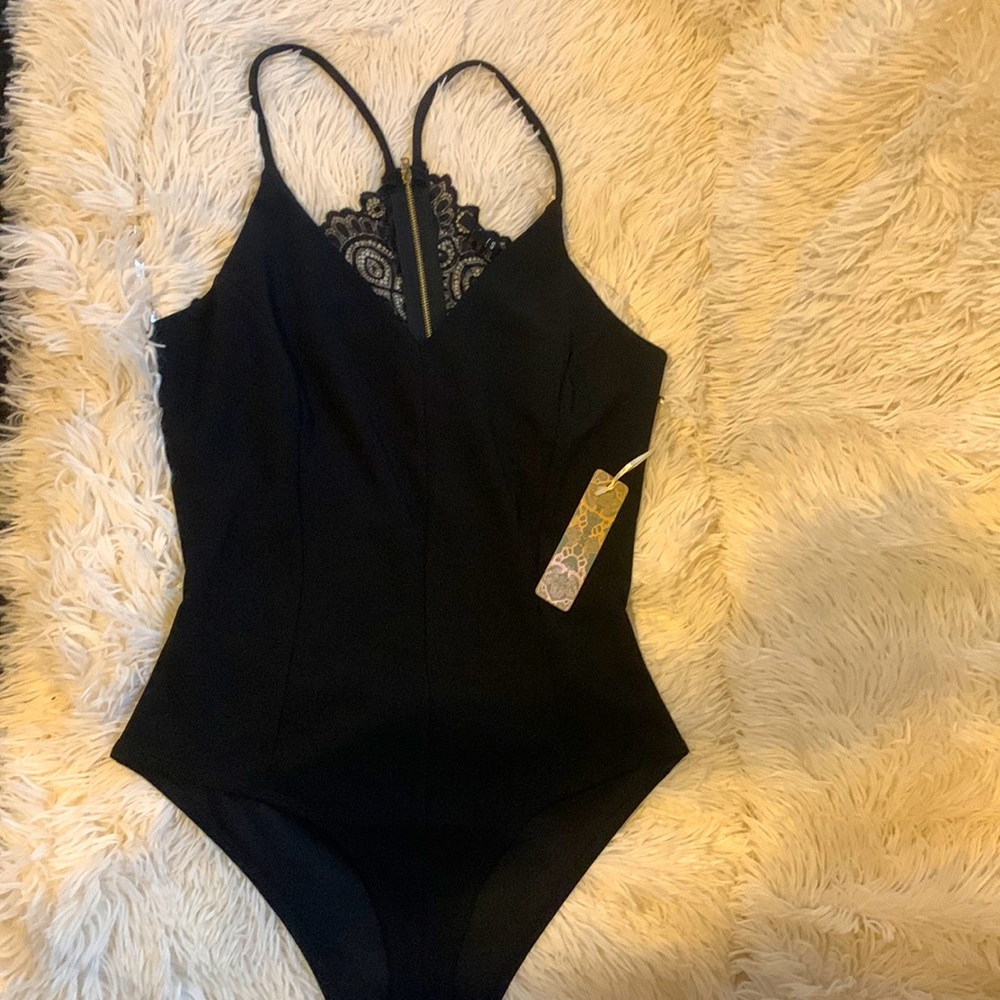 Sexy black bodysuit with open back/lace zip detail. Size Medium. NWT